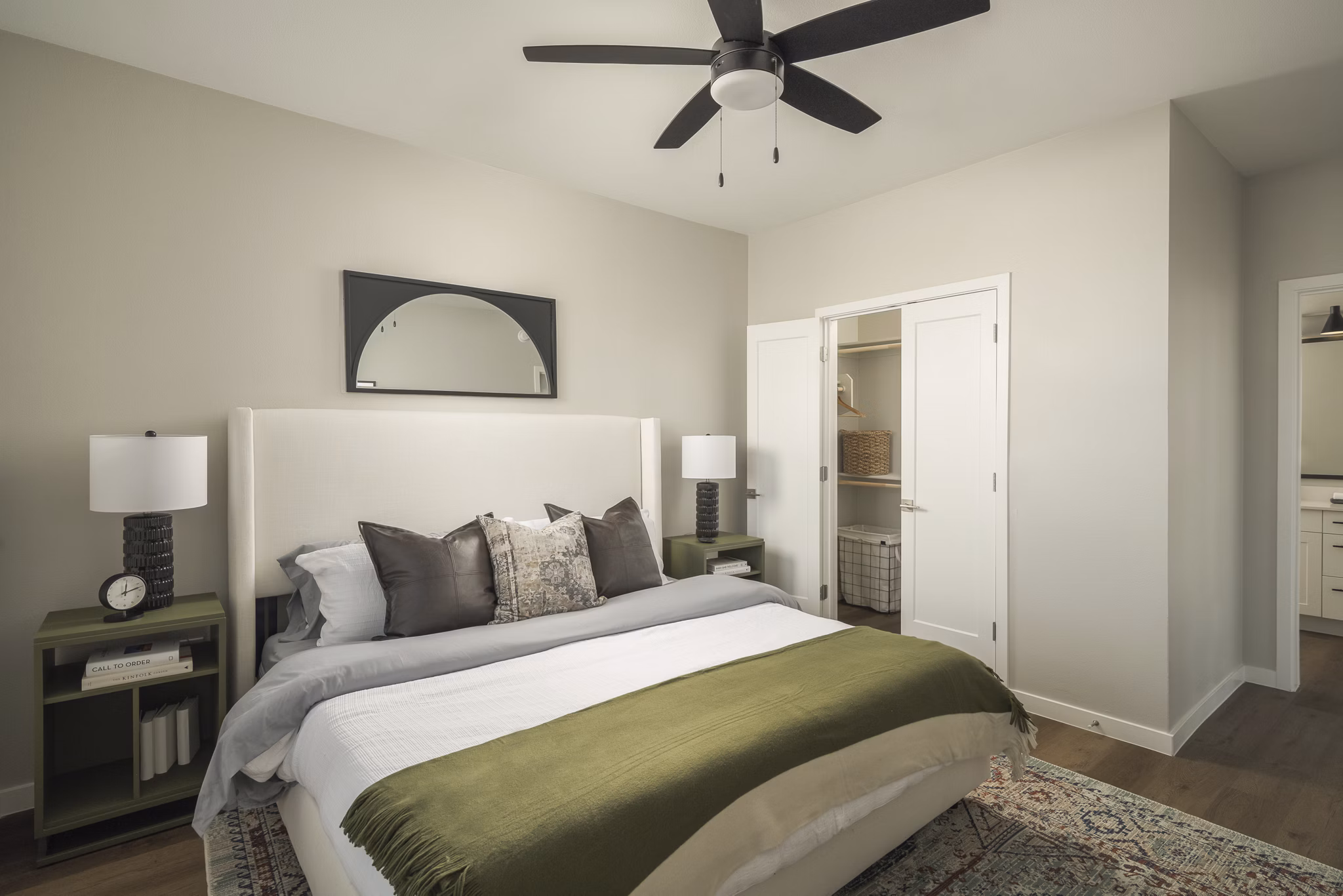 Cozy bedroom with modern furnishings at Smith + Rio Apartments, offering luxury living in a vibrant community