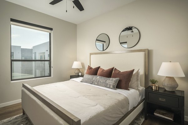 Cozy bedroom with modern decor at Smith + Rio Apartments