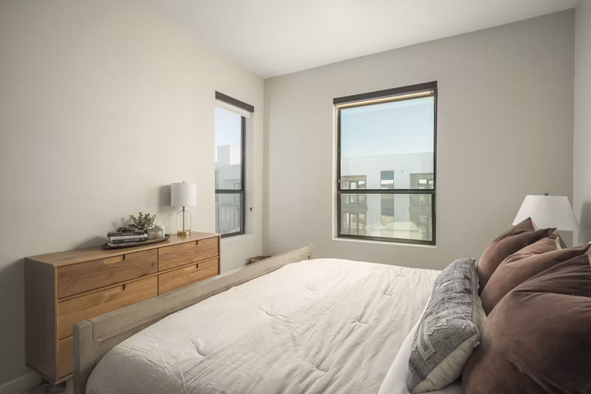 Stylish bedroom with modern furnishings at Smith + Rio Apartments