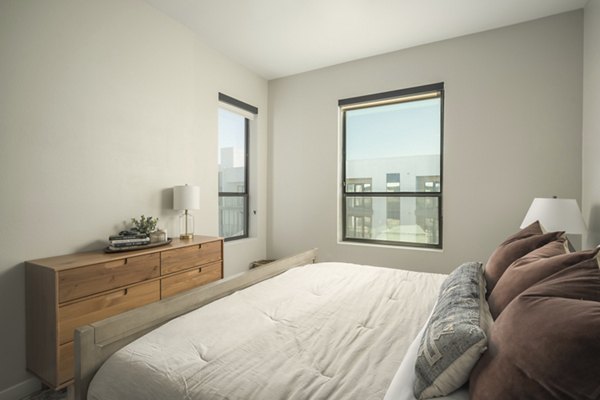 Stylish bedroom with modern furnishings at Smith + Rio Apartments
