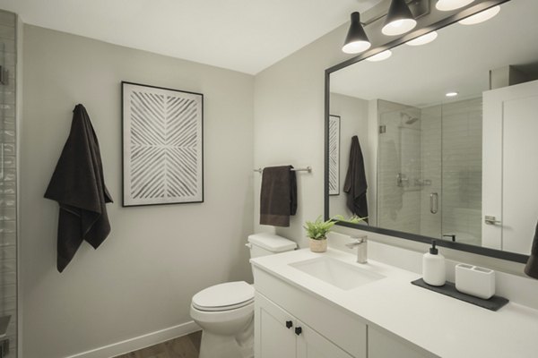 Contemporary bathroom with sleek fixtures at Smith + Rio Apartments