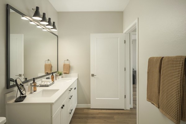 Bathroom featuring modern fixtures and sleek design in Smith + Rio Apartments' luxury units
