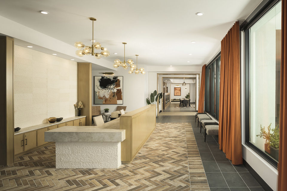 Clubhouse with modern design and seating areas at Smith + Rio Apartments