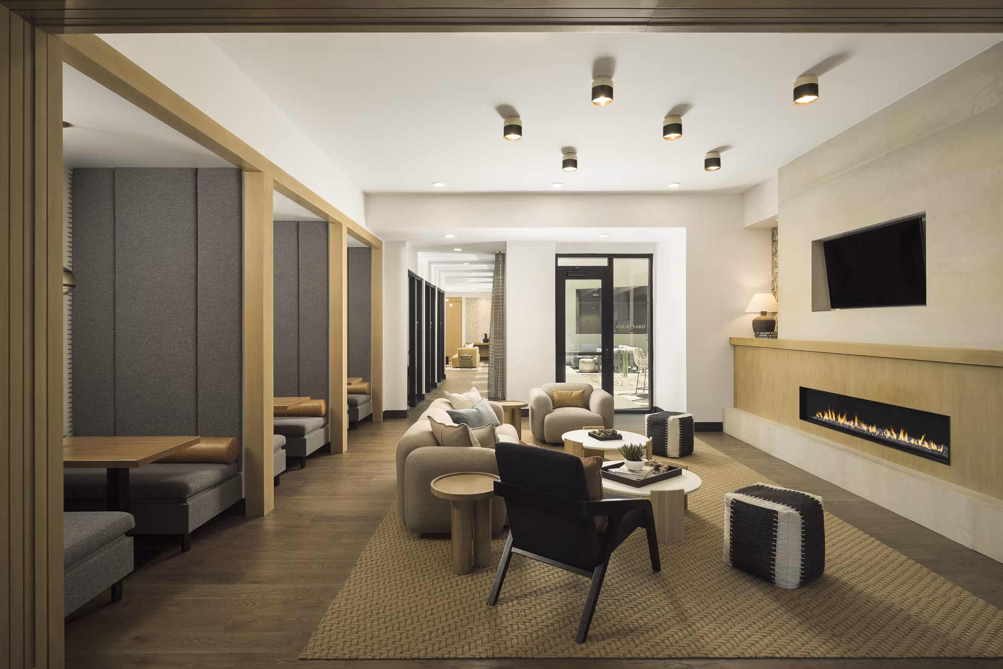 Stylish clubhouse with contemporary decor at Smith + Rio Apartments, featuring seating areas and modern lighting