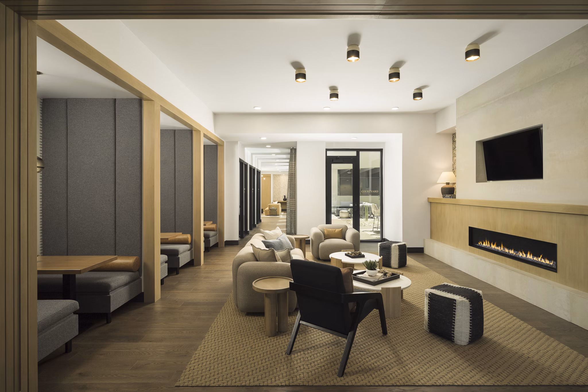 Stylish clubhouse with contemporary decor at Smith + Rio Apartments, featuring seating areas and modern lighting