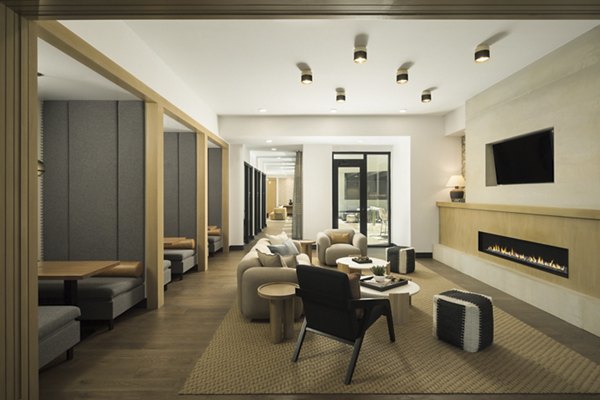 Stylish clubhouse with contemporary decor at Smith + Rio Apartments, featuring seating areas and modern lighting