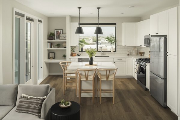 Modern kitchen with granite countertops in Smith + Rio Apartments