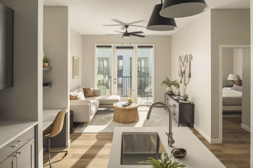 Modern kitchen with stainless steel appliances in Smith + Rio Apartments