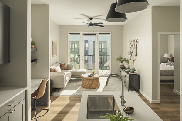 Modern kitchen with stainless steel appliances in Smith + Rio Apartments