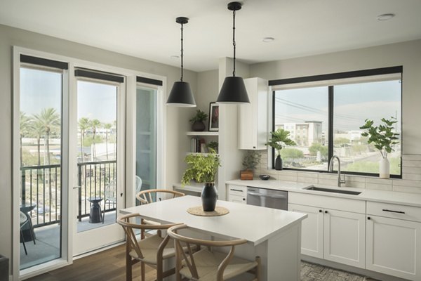 Modern kitchen featuring stainless steel appliances in Smith + Rio Apartments