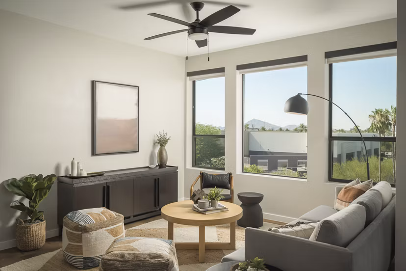 Spacious living room with modern decor at Smith + Rio Apartments