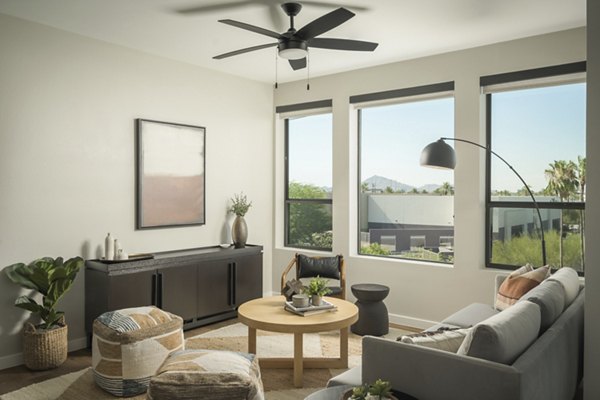 Spacious living room with modern decor at Smith + Rio Apartments