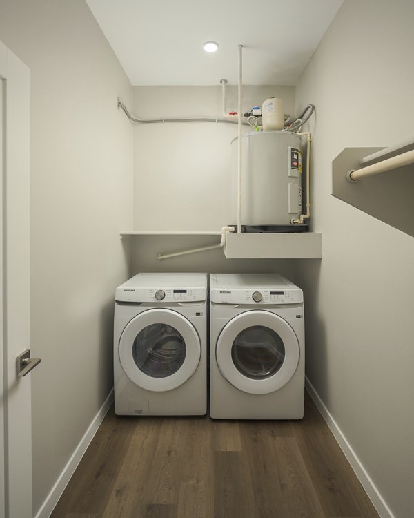 Spacious laundry room with modern appliances at Smith + Rio Apartments