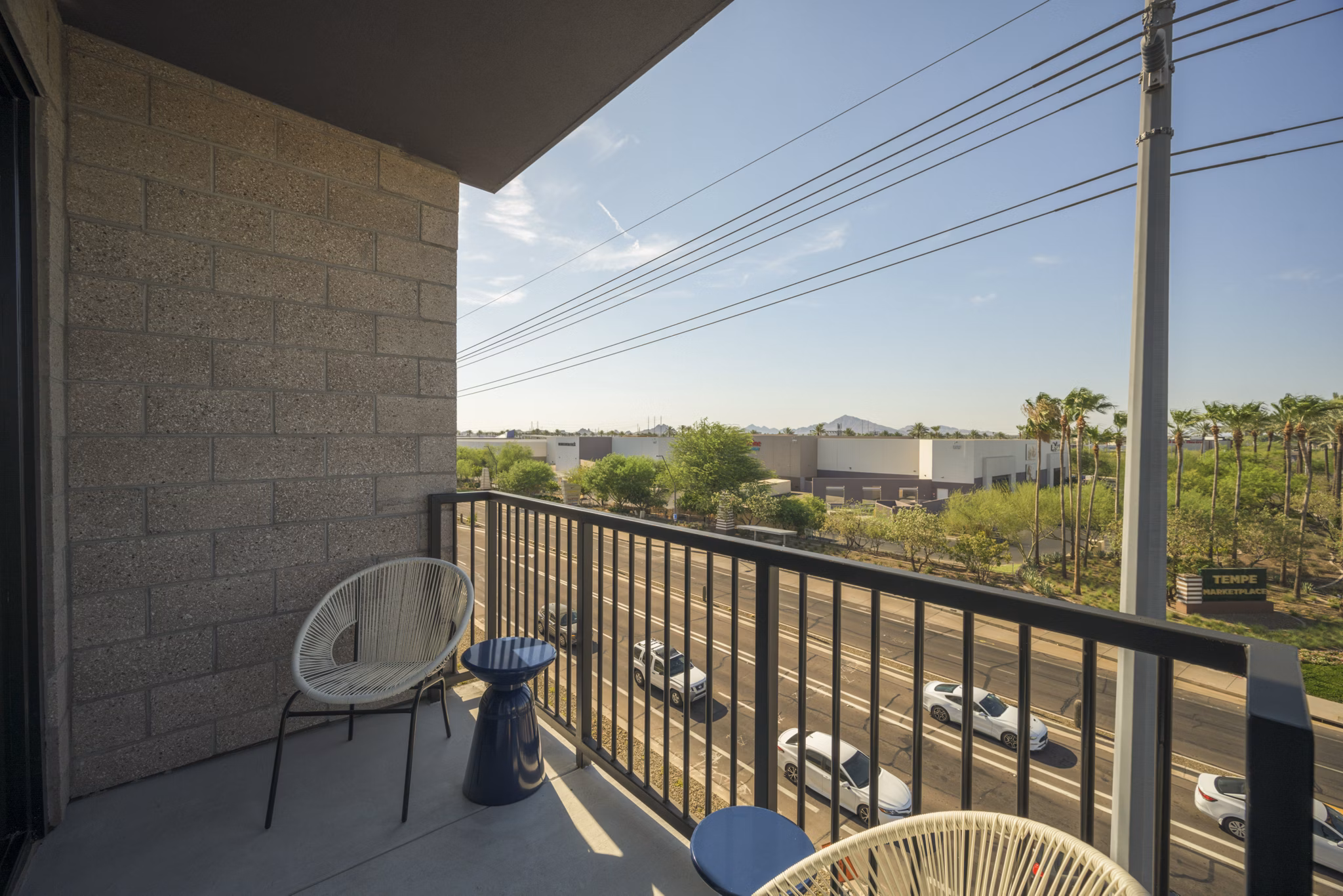 Smith + Rio Apartments: Chic patio with cozy seating and lush greenery at luxury Greystar property