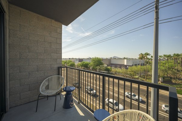Smith + Rio Apartments: Chic patio with cozy seating and lush greenery at luxury Greystar property