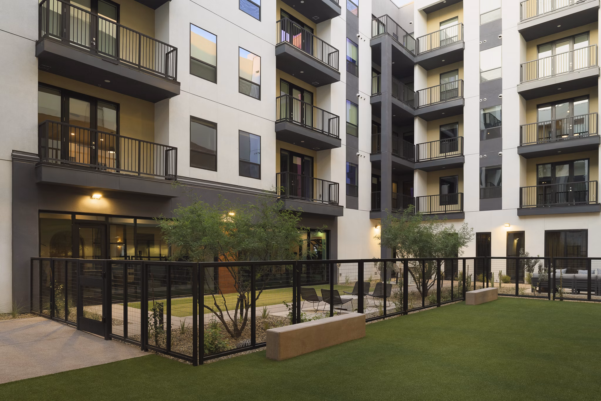 Spacious dog park with agility equipment at Smith + Rio Apartments