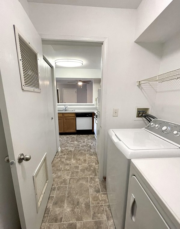 Laundry room with modern appliances at Fox Pointe luxury apartments