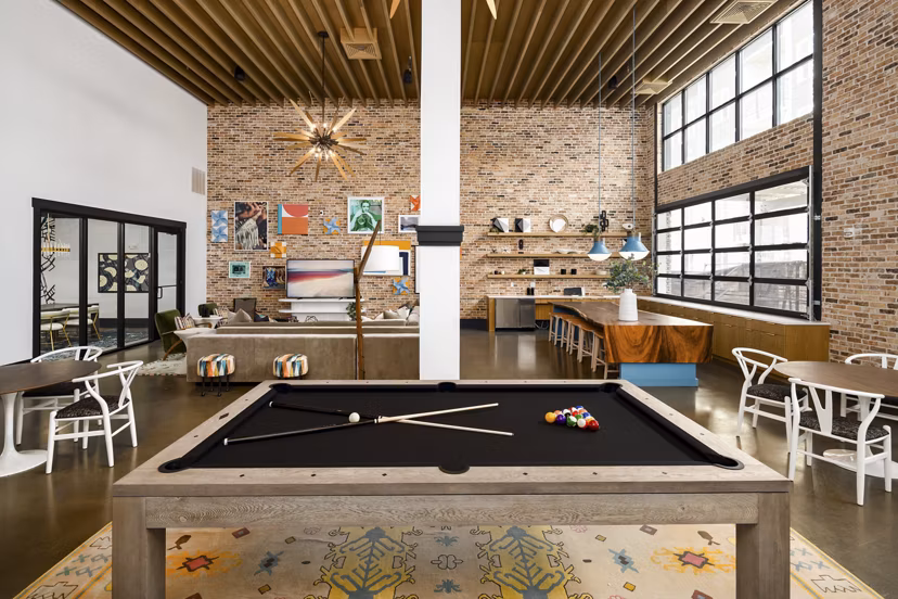 Stylish clubhouse featuring modern seating and entertainment options at Soundwater Apartments