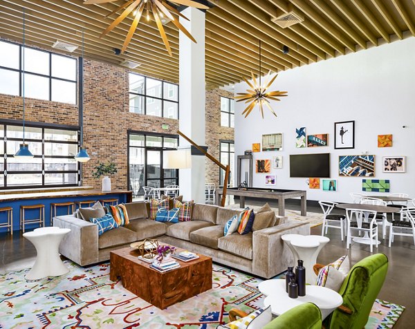 Stylish clubhouse featuring modern seating and entertainment options at Soundwater Apartments