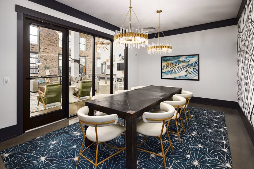 Clubhouse game room with billiards and lounge seating at Soundwater Apartments, perfect for luxury living experiences