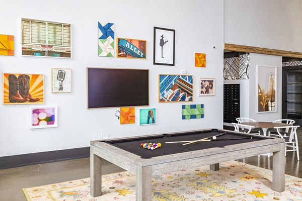 Clubhouse game room with billiards and lounge seating at Soundwater Apartments, perfect for luxury living experiences