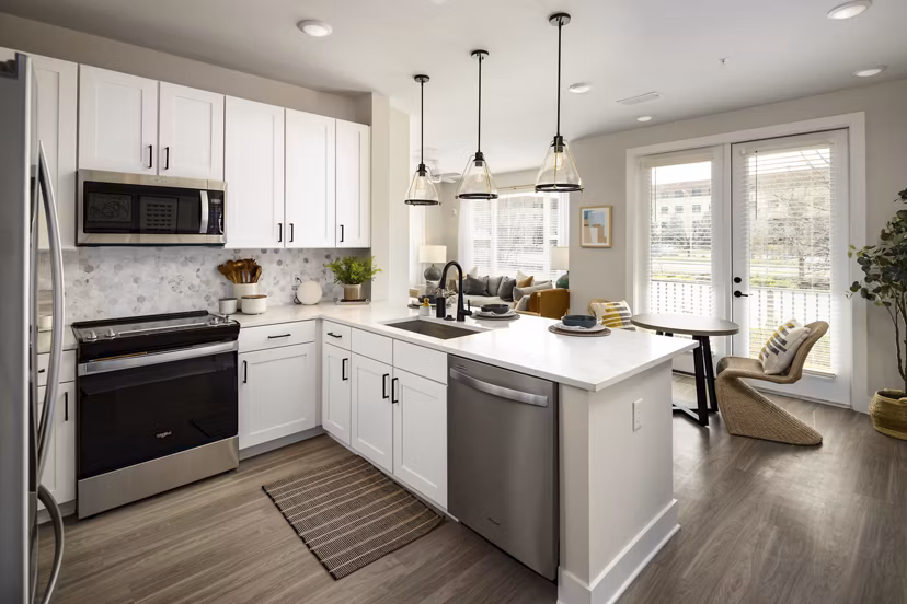 Modern kitchen with stainless steel appliances at Soundwater Apartments