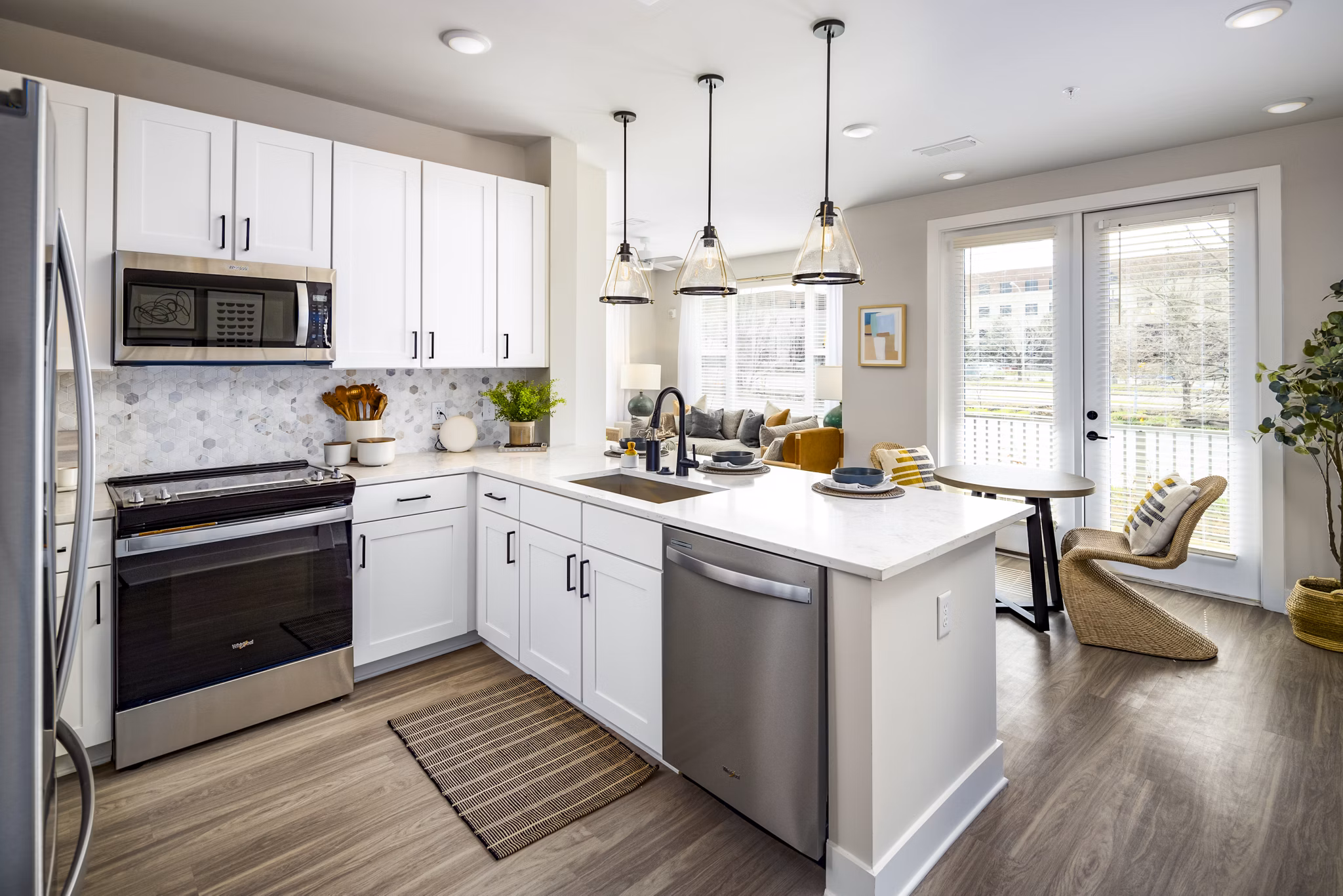 Modern kitchen with stainless steel appliances at Soundwater Apartments