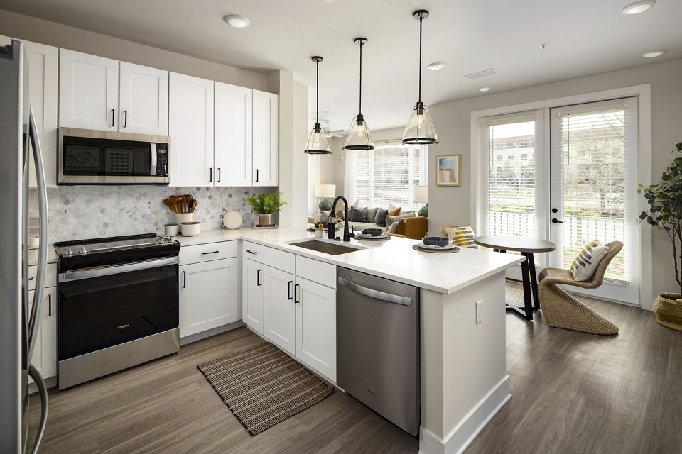 Modern kitchen with stainless steel appliances at Soundwater Apartments