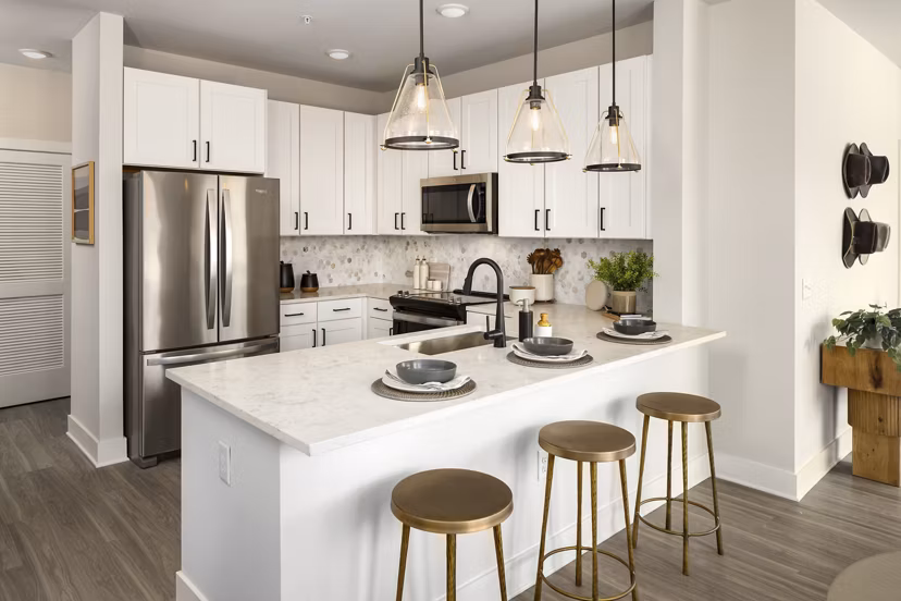 Modern kitchen with stainless steel appliances at Soundwater Apartments, a luxury Greystar community in a prime waterfront location