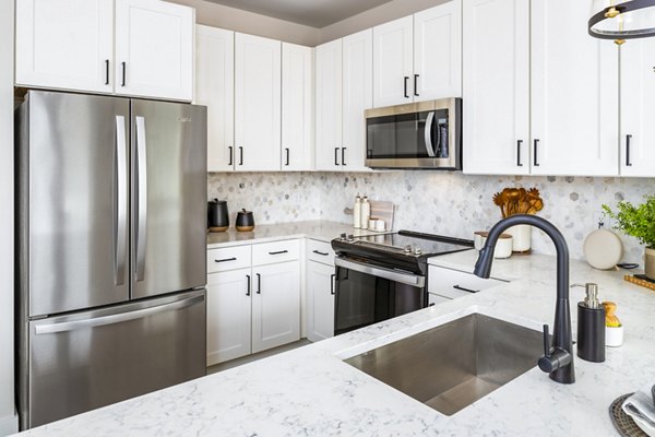 Modern kitchen with sleek finishes at Soundwater Apartments