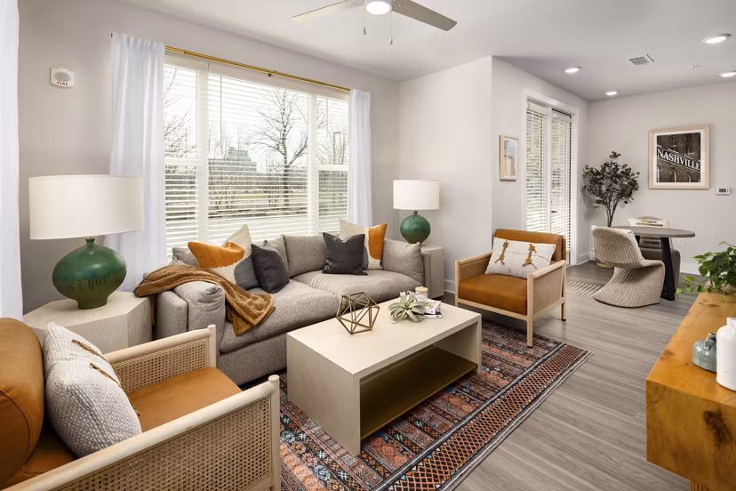 Spacious living room with modern decor in Soundwater Apartments, offering luxury living by Greystar