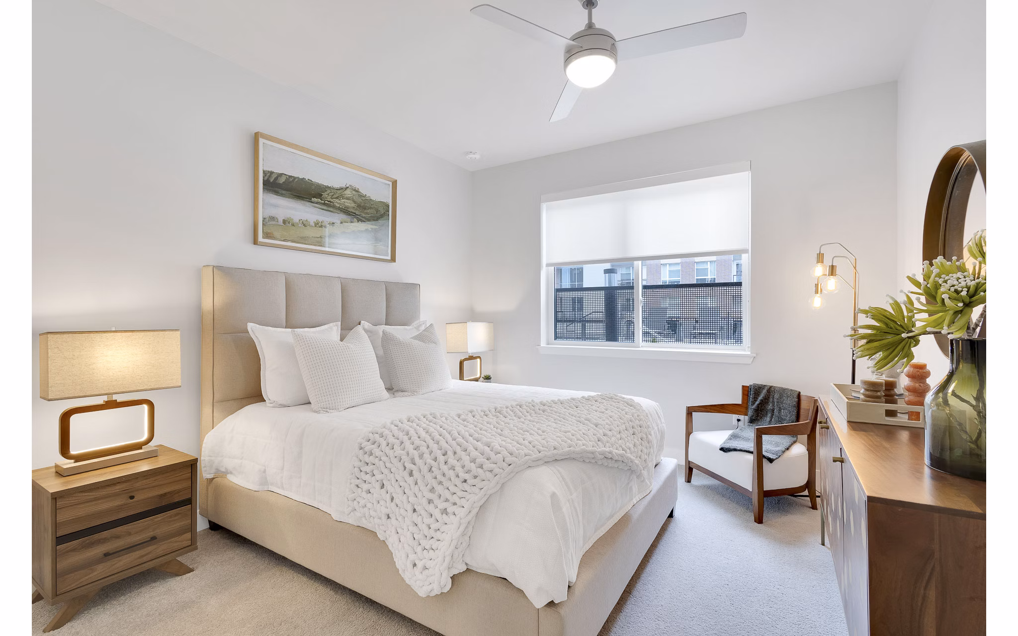 Cozy bedroom with designer furniture at The Dorsey Apartments, Greystar luxury living