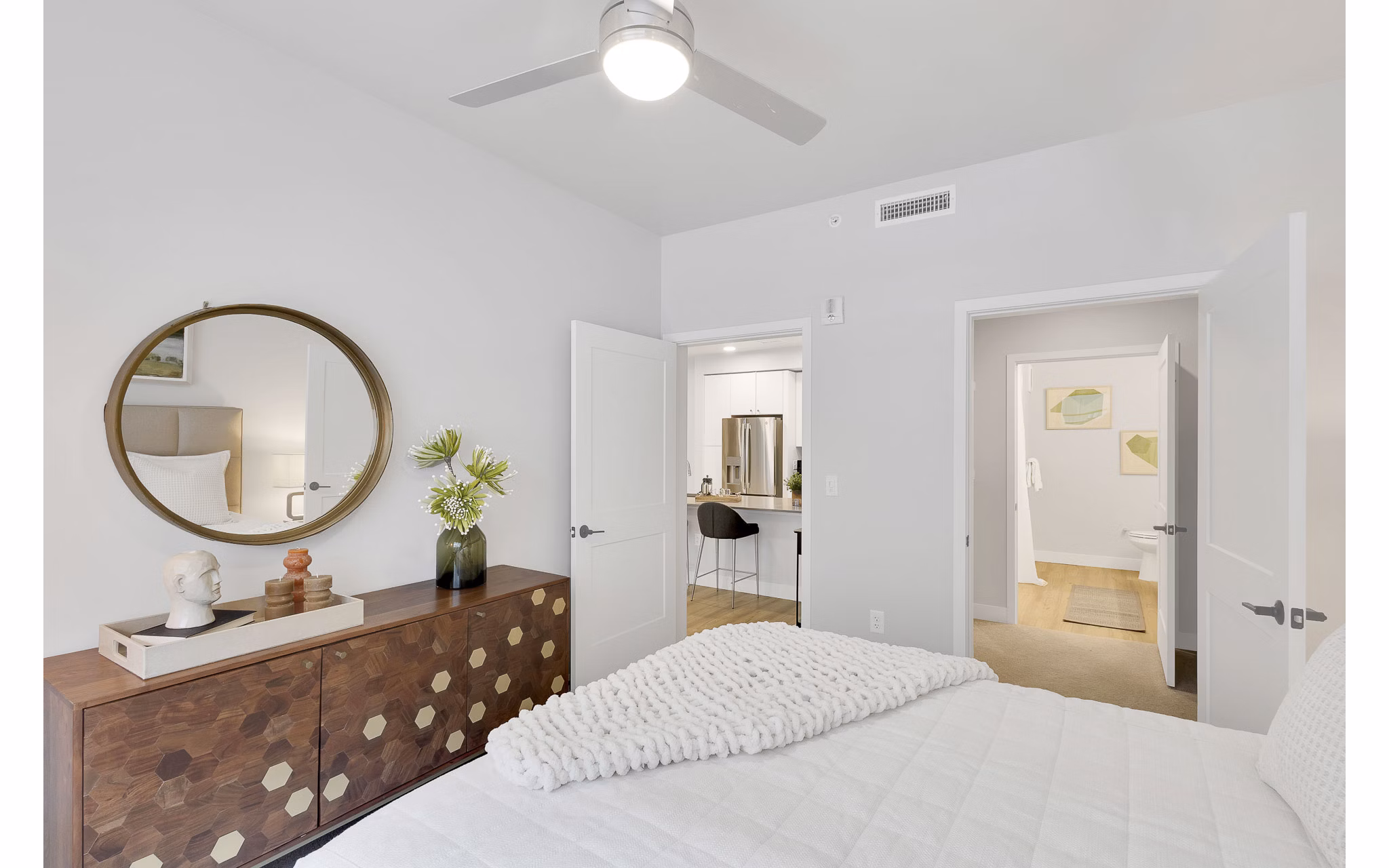 Cozy bedroom featuring a plush queen bed at The Dorsey Apartments in a luxurious setting