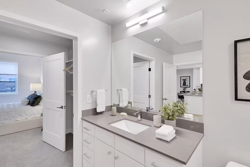 Luxurious bathroom with marble countertops and modern fixtures at The Dorsey Apartments, a Greystar luxury property