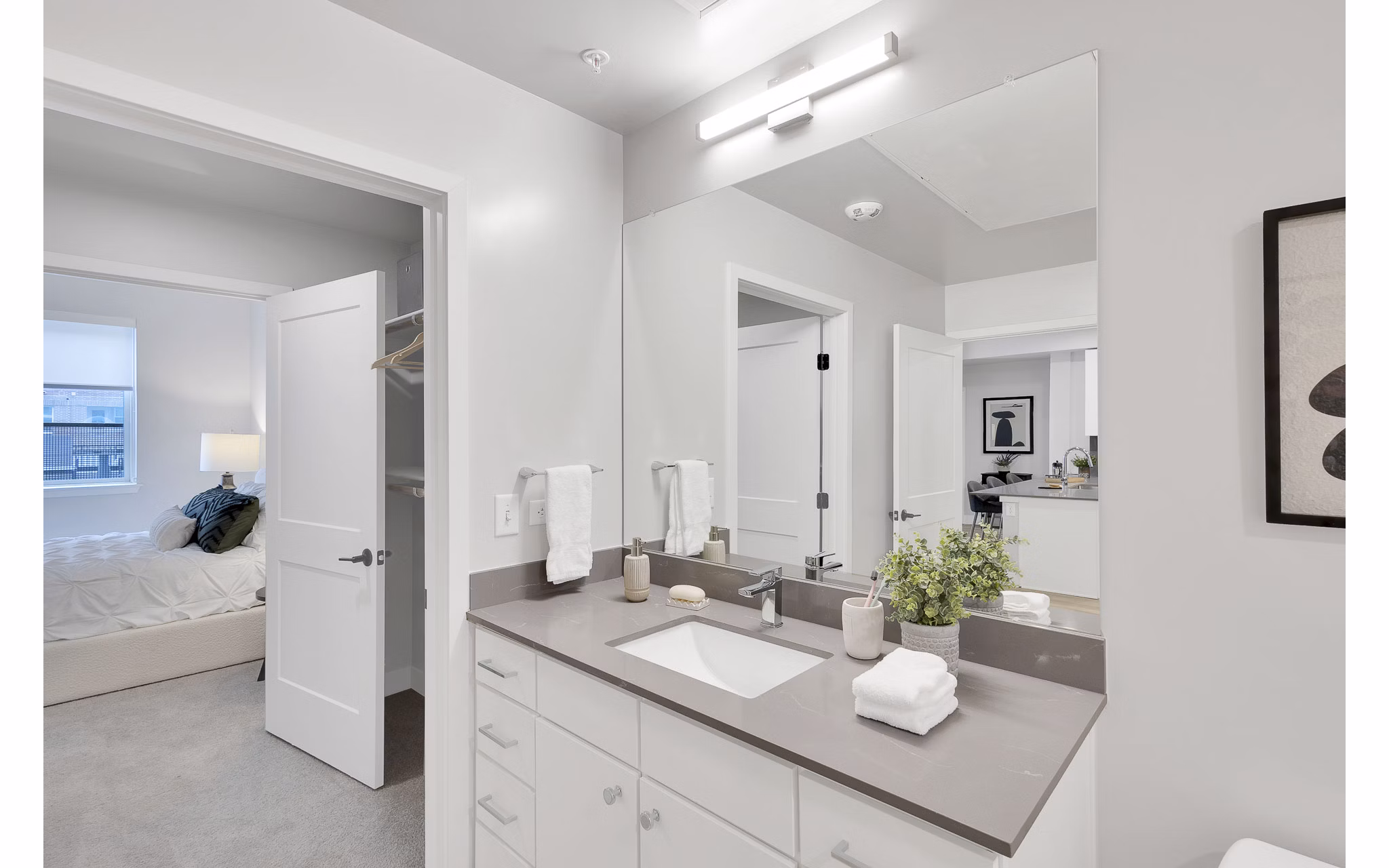 Luxurious bathroom with marble countertops and modern fixtures at The Dorsey Apartments, a Greystar luxury property