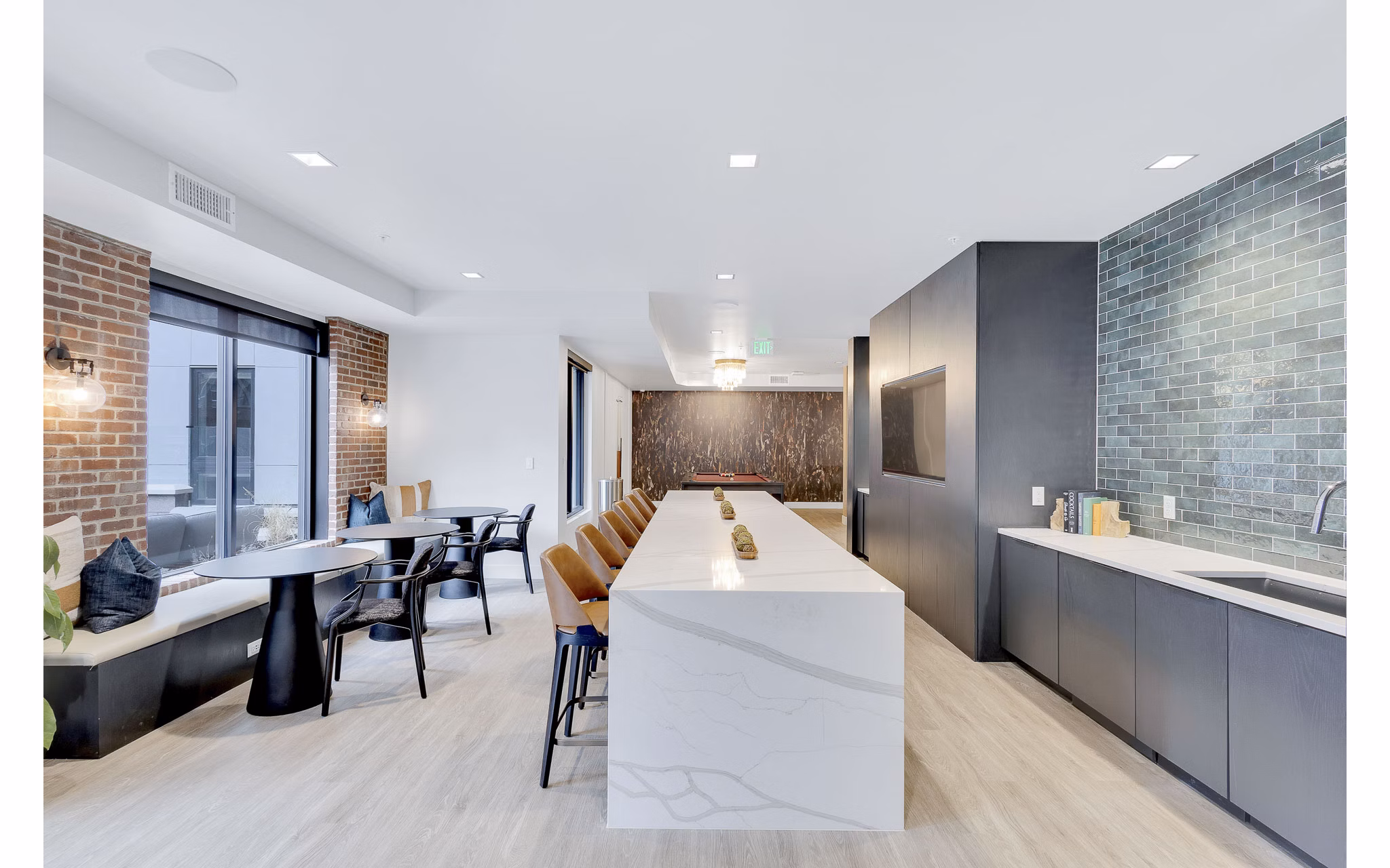 The Dorsey Apartments: Elegant clubhouse with modern decor and ample seating, perfect for social gatherings and events