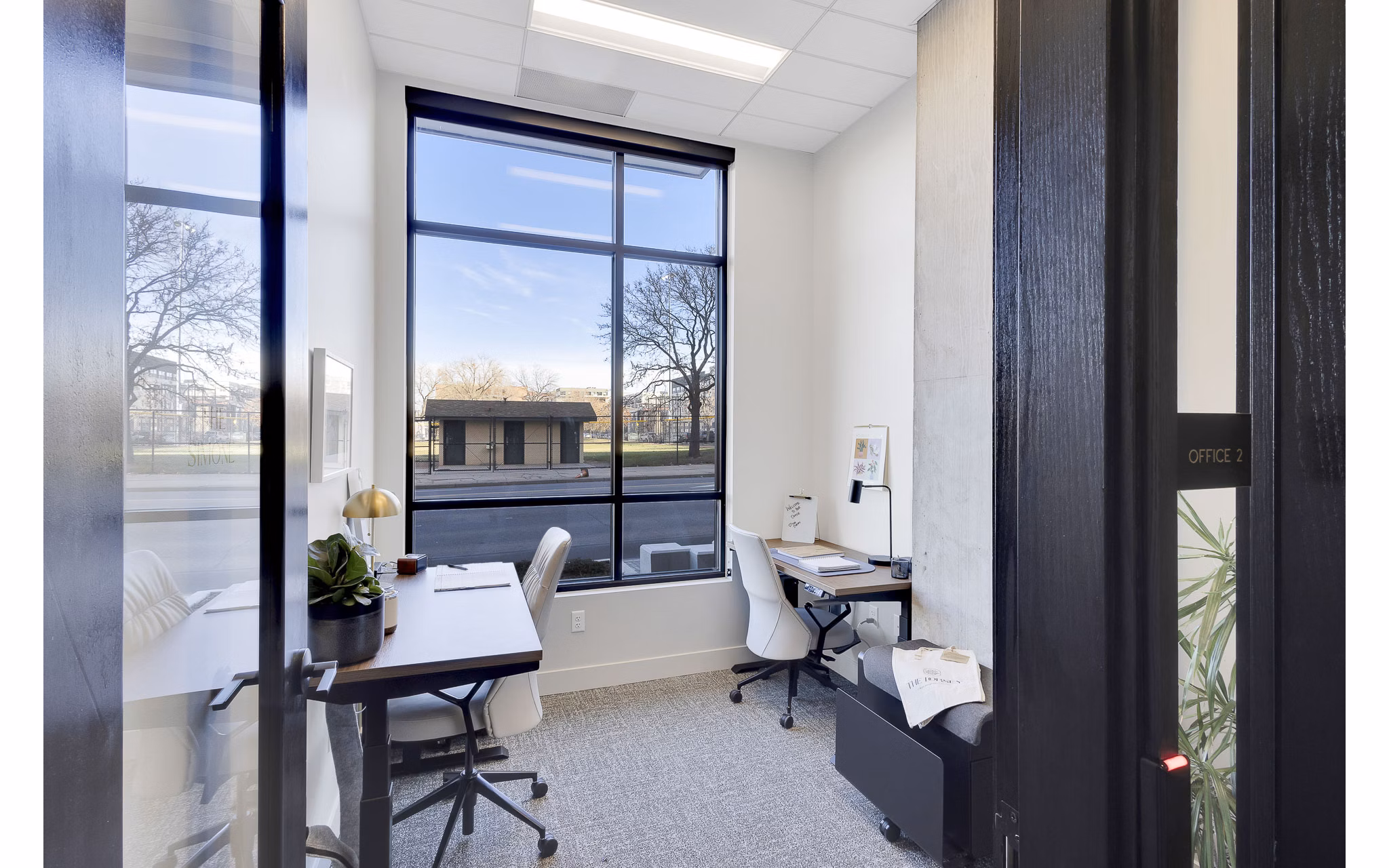 Clubhouse with modern furnishings and communal seating at The Dorsey Apartments, offering luxury living spaces for relaxation and socializing
