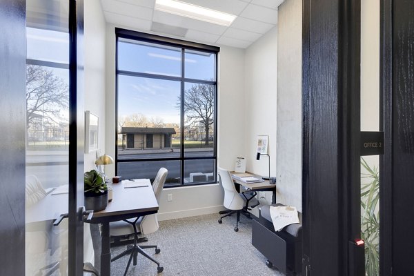 Clubhouse with modern furnishings and communal seating at The Dorsey Apartments, offering luxury living spaces for relaxation and socializing