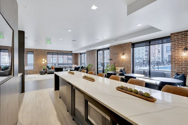 Modern clubhouse with sleek design at The Dorsey Apartments; luxury living spaces for social gatherings and relaxation