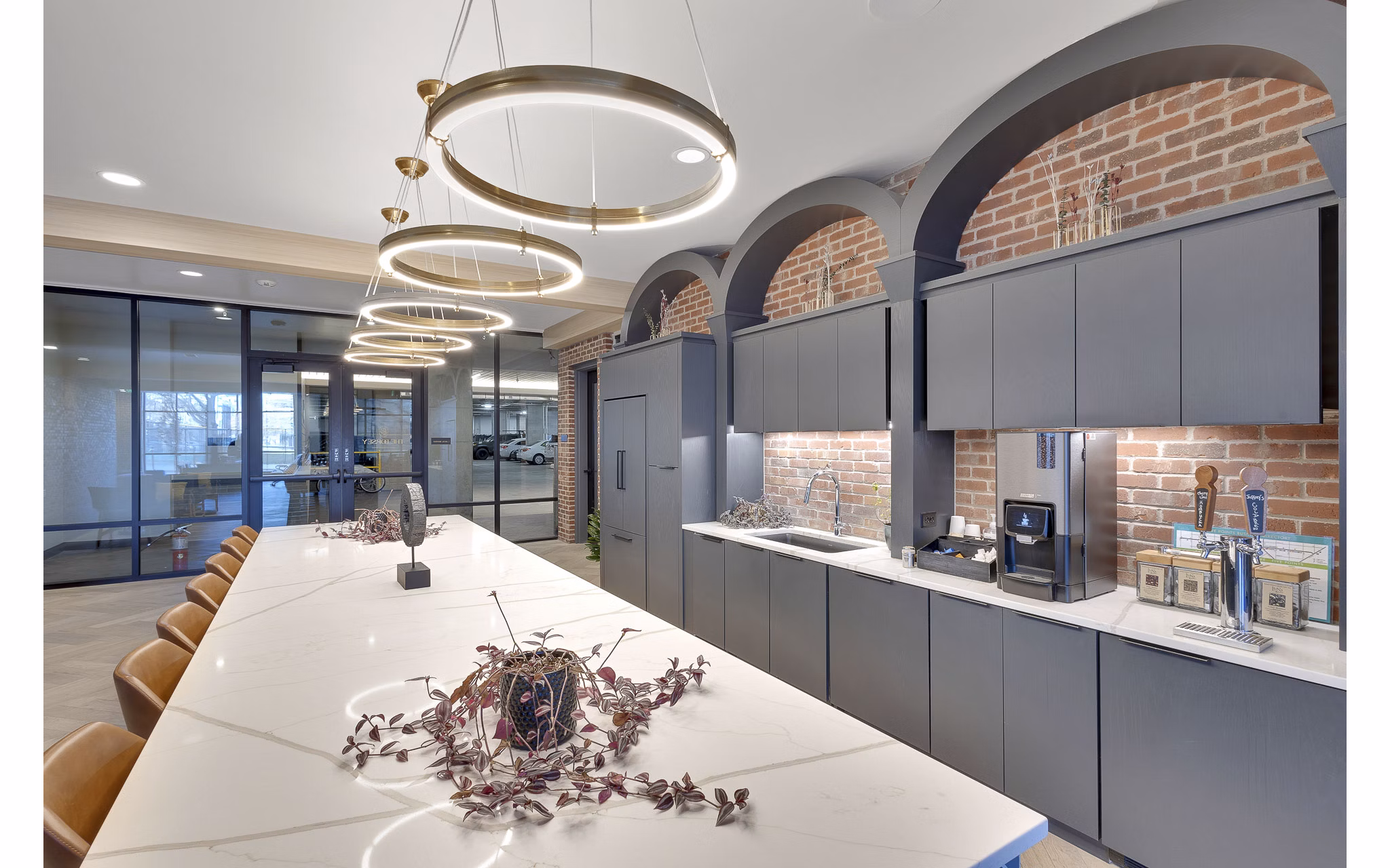 The Dorsey Apartments: Stylish clubhouse with modern seating and workspace