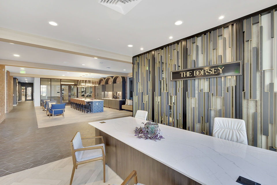 The Dorsey Apartments: Elegant clubhouse with modern decor and cozy seating areas