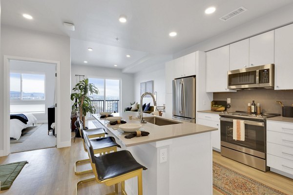 Modern kitchen with stainless steel appliances at The Dorsey Apartments