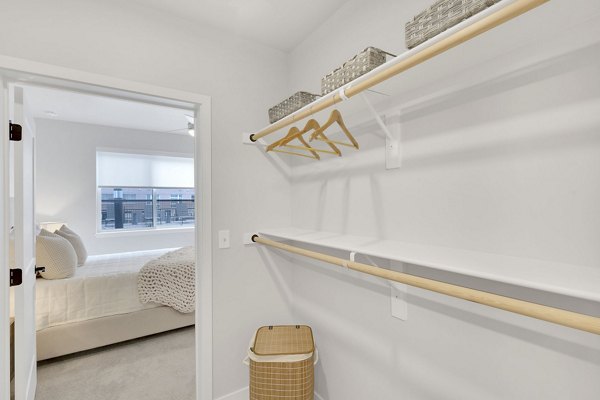 Laundry room with modern appliances and ample storage at The Dorsey Apartments, luxury living with convenient amenities