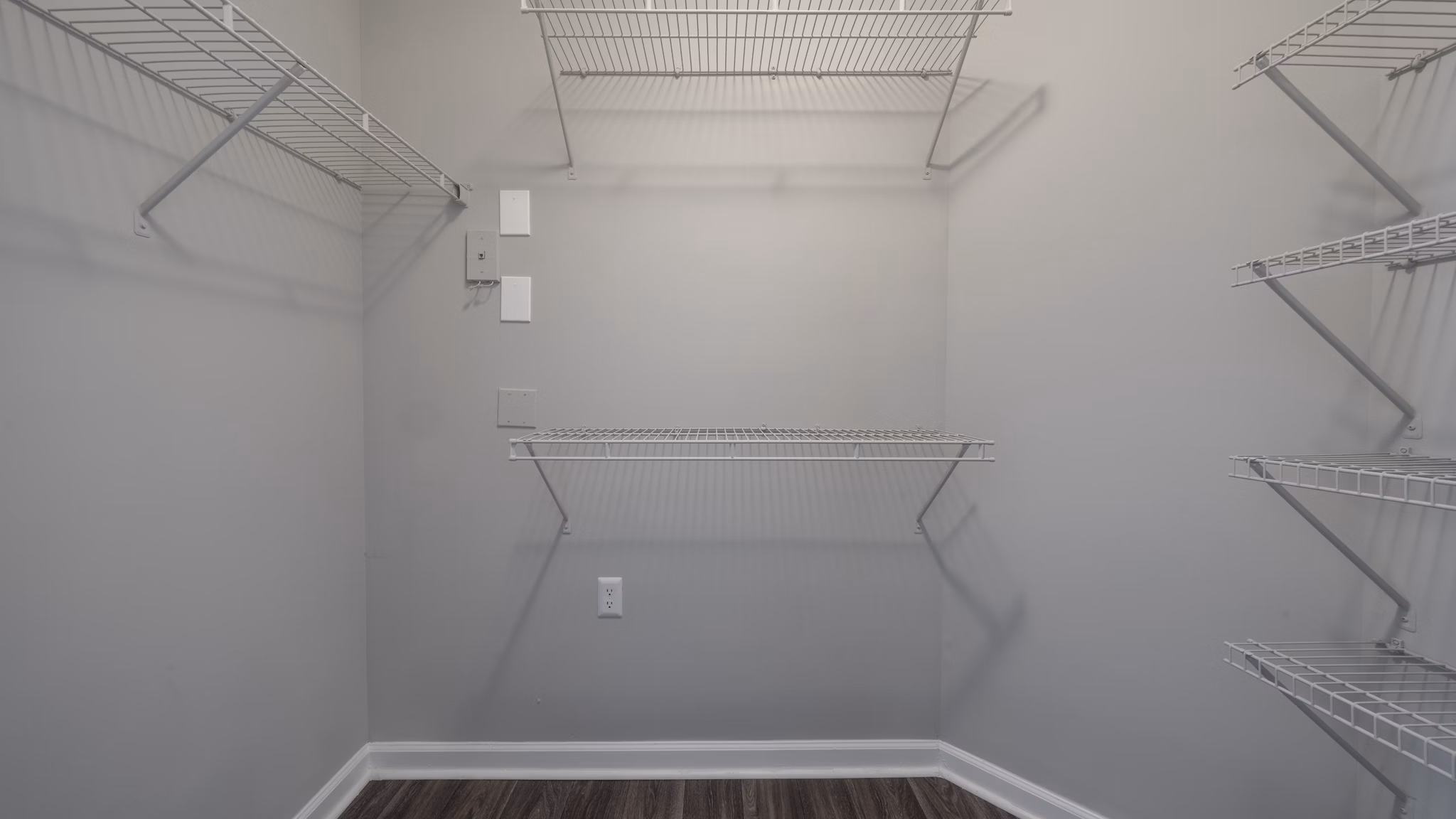 Walk-in closet with ample shelving and storage space at The Slate Apartments