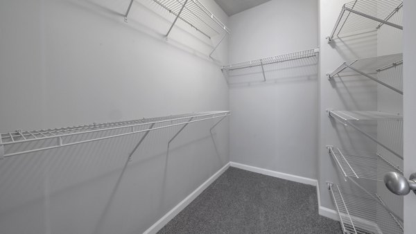 Walk-in closet with ample storage space at The Slate Apartments