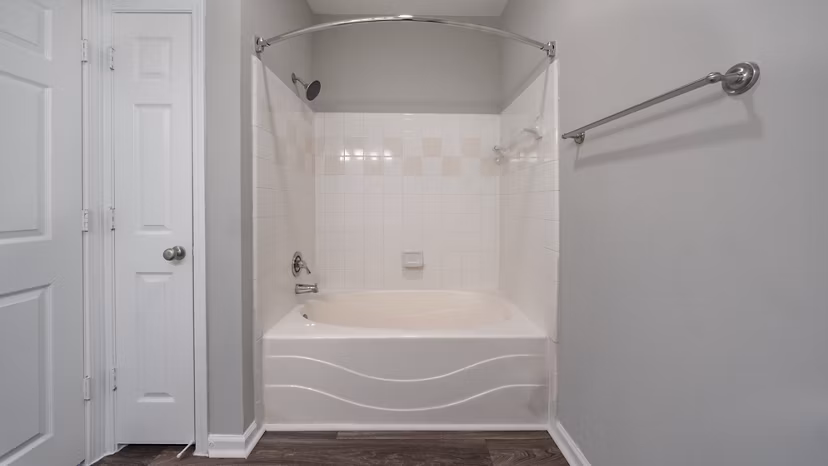 Bathroom with sleek fixtures and granite countertops at The Slate Apartments