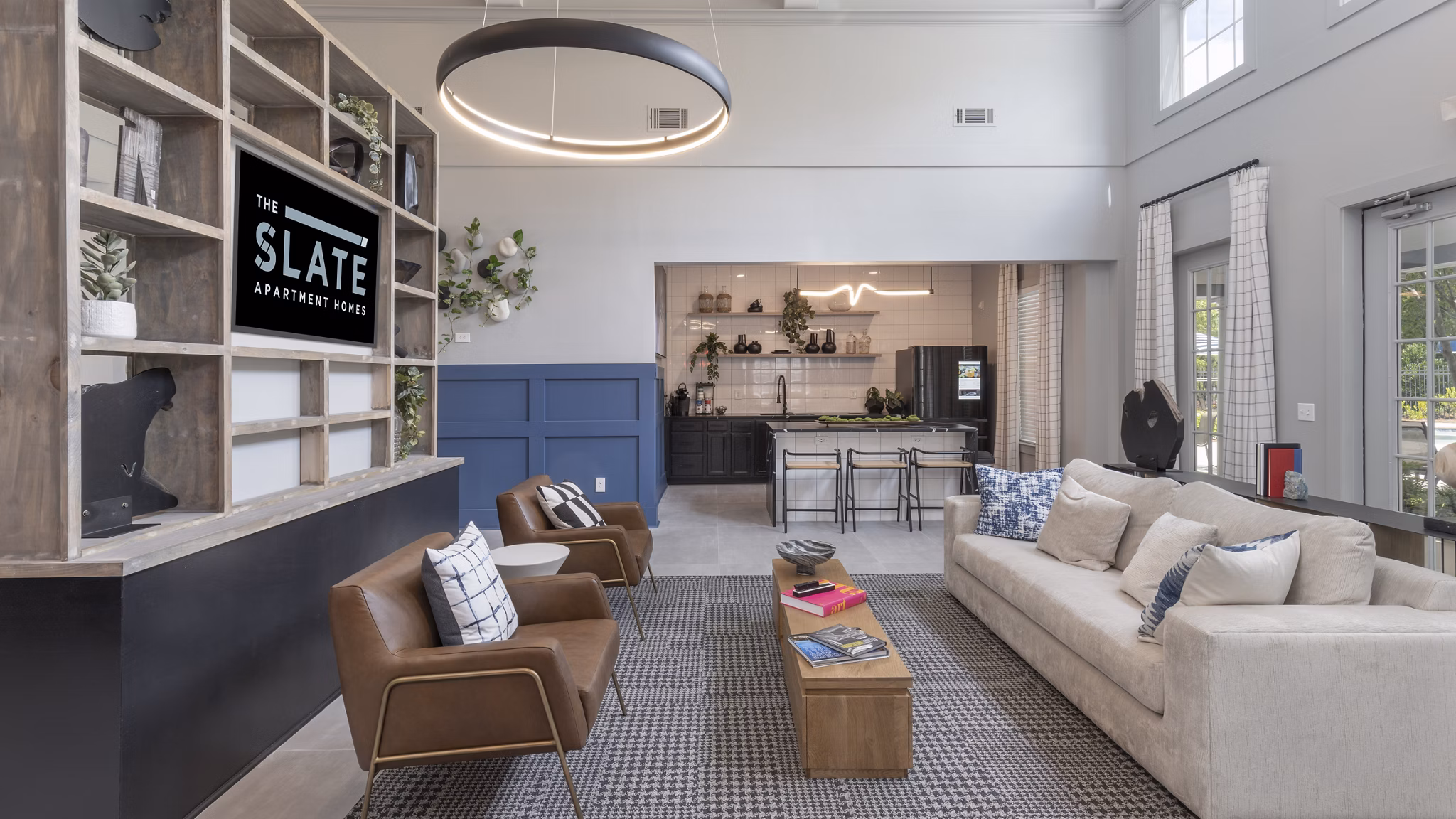 Elegant clubhouse with modern decor at The Slate Apartments, offering premium amenities ideal for social gatherings and community events