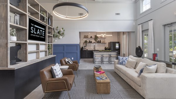 Elegant clubhouse with modern decor at The Slate Apartments, offering premium amenities ideal for social gatherings and community events