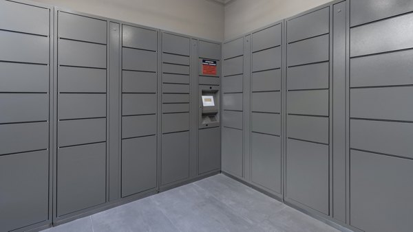 Mail room with secure package lockers at The Slate Apartments