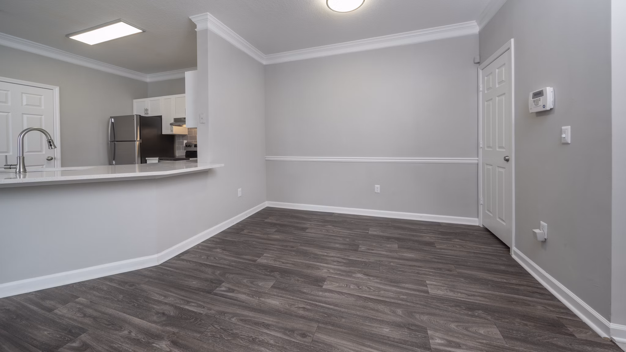 Dining area with elegant table setting at The Slate Apartments highlighting luxury living